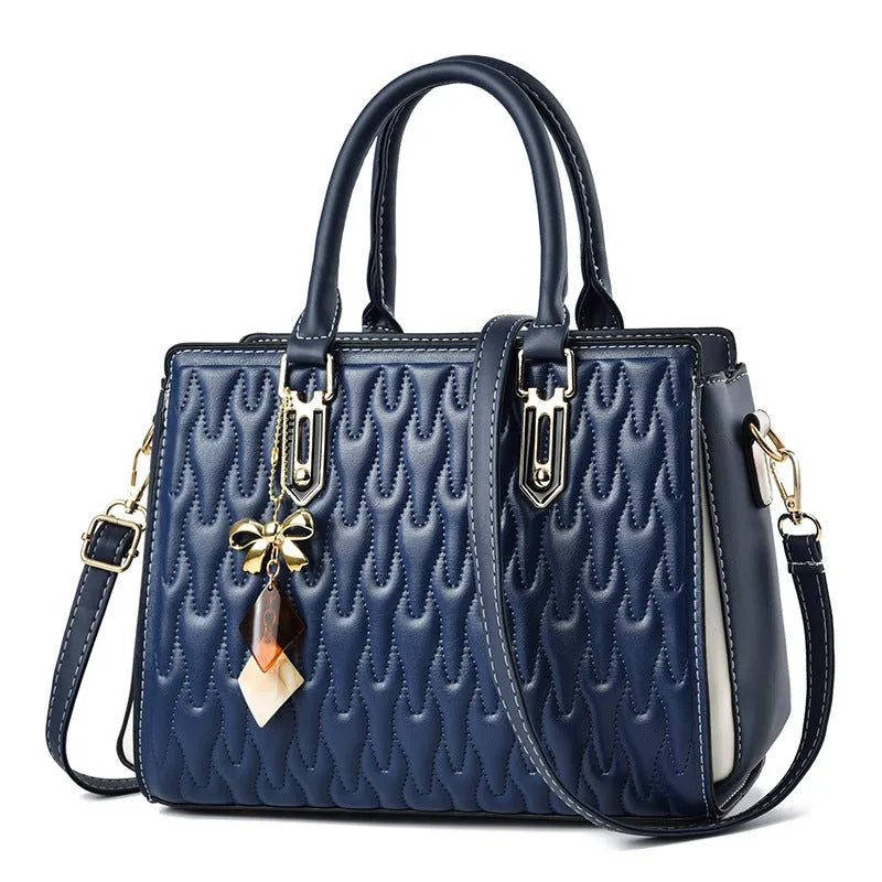 Women's shoulder messenger bag in dark blue with outer pocket sandwich design and adjustable strap