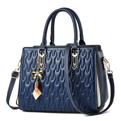 Women's shoulder messenger bag in dark blue with outer pocket sandwich design and adjustable strap