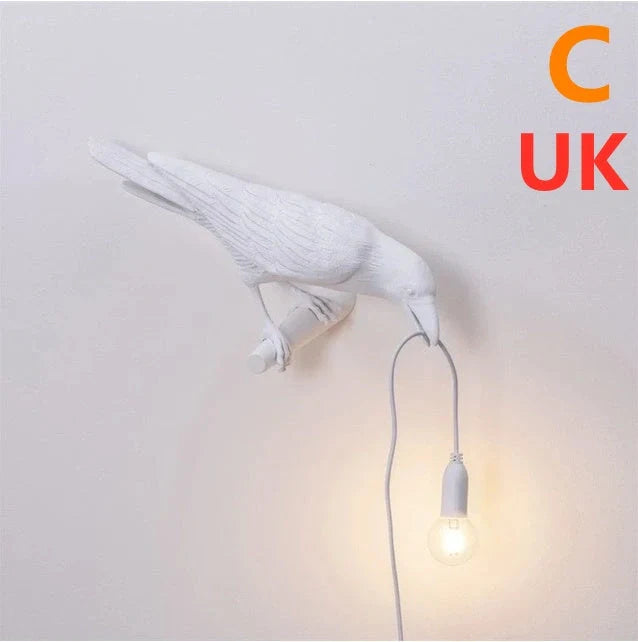 Elegant Resin Bird Wall Lamp illuminating a cozy room with its unique design