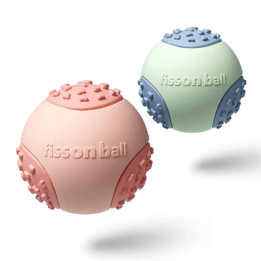 Green rolling ball dog toy with 64mm diameter for small to medium breeds on floor