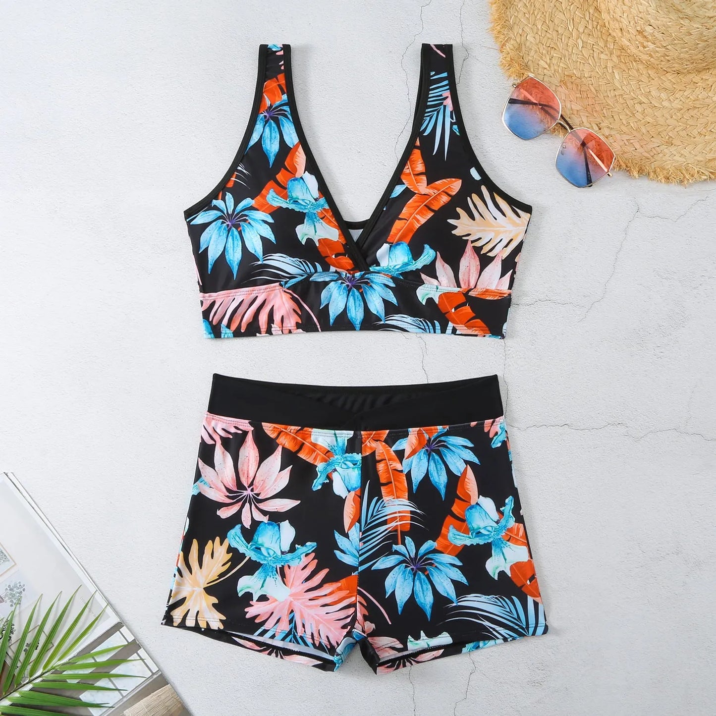 Women's two-piece printed swimsuit set with boxer-style briefs and sleeveless top in multi-colour pattern