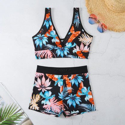 Women's two-piece printed swimsuit set with boxer-style briefs and sleeveless top in multi-colour pattern