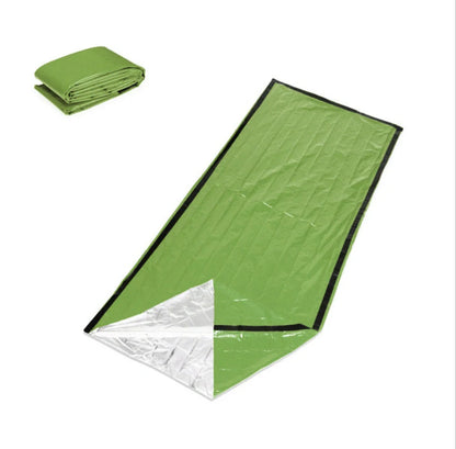 Orange First-aid Tent Insulation Mat reflecting sunlight, ready for emergency use