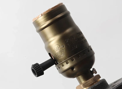 Water pipe table lamp with wood and iron construction measuring 9cm wide by 13cm tall