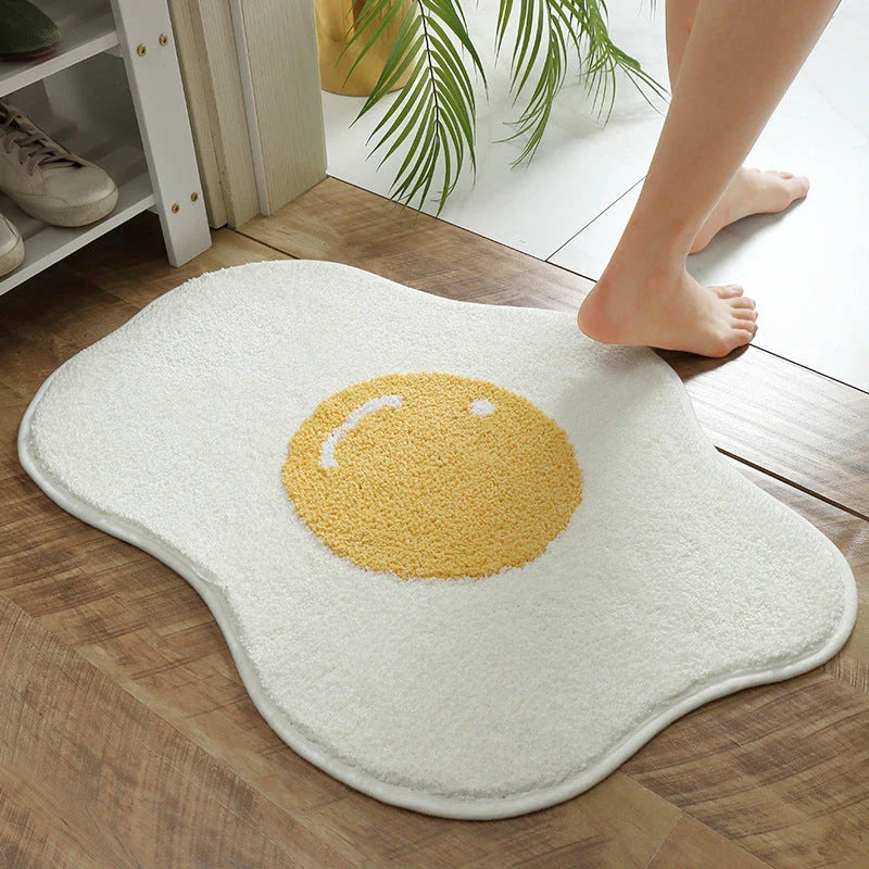 Stylish and functional egg-shaped area rug with a playful design, perfect for adding charm and protecting floors in your home.