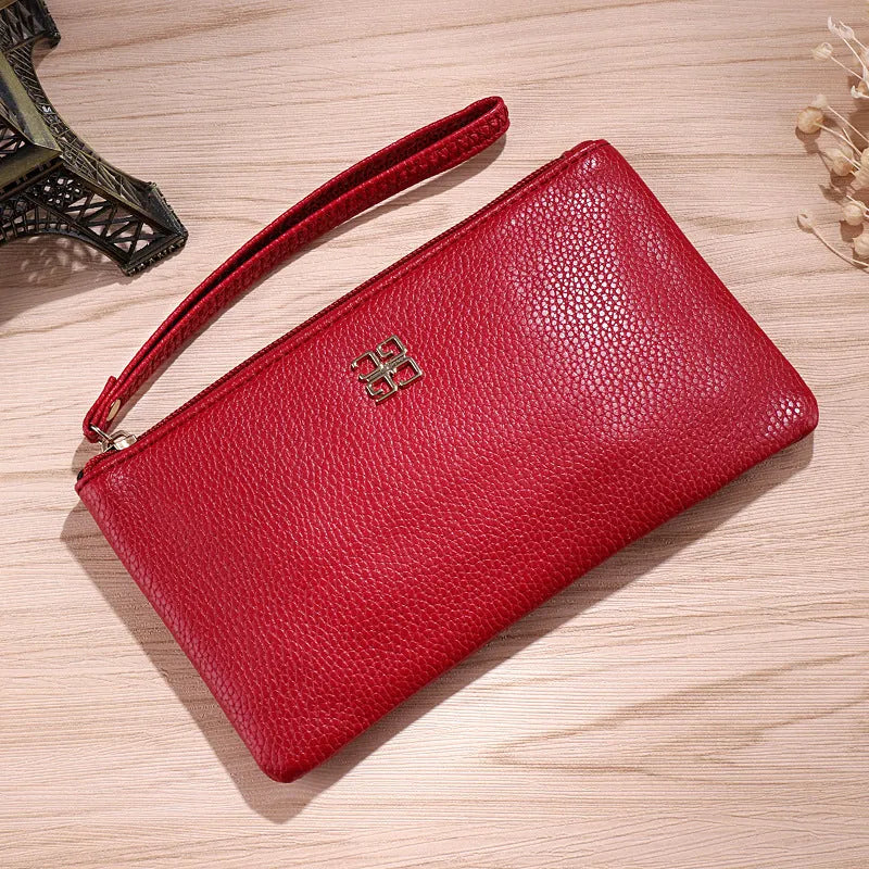Long 55 cm PU leather wallet handbag in wine red colour with zipper closure open showing interior phone pocket and card slots