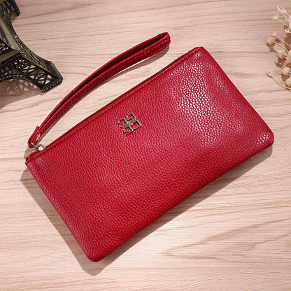 Long 55 cm PU leather wallet handbag in wine red colour with zipper closure open showing interior phone pocket and card slots
