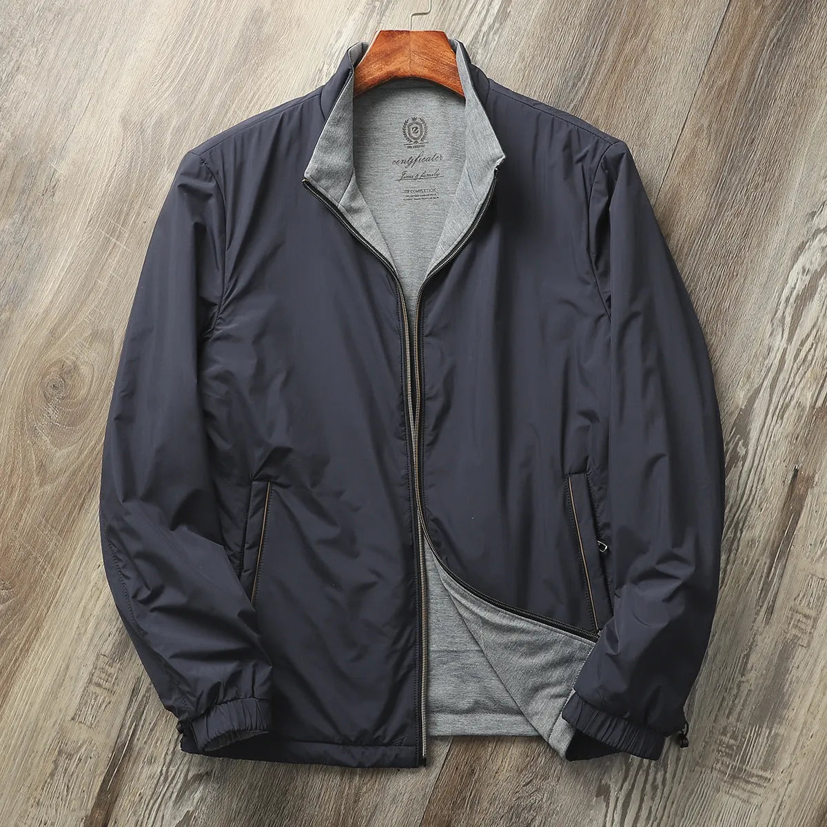 Men's simple stand collar casual jacket in army green, shown on a model.