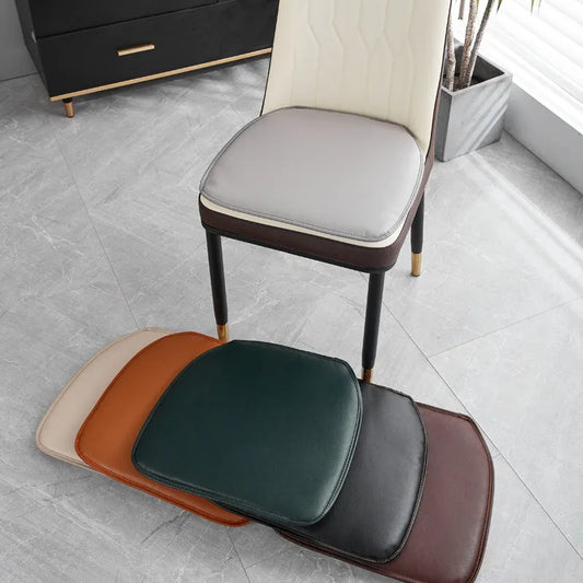 Leather horseshoe-shaped seat cushion in beige colour on a chair, showing non-slip base and 2.5cm thickness.