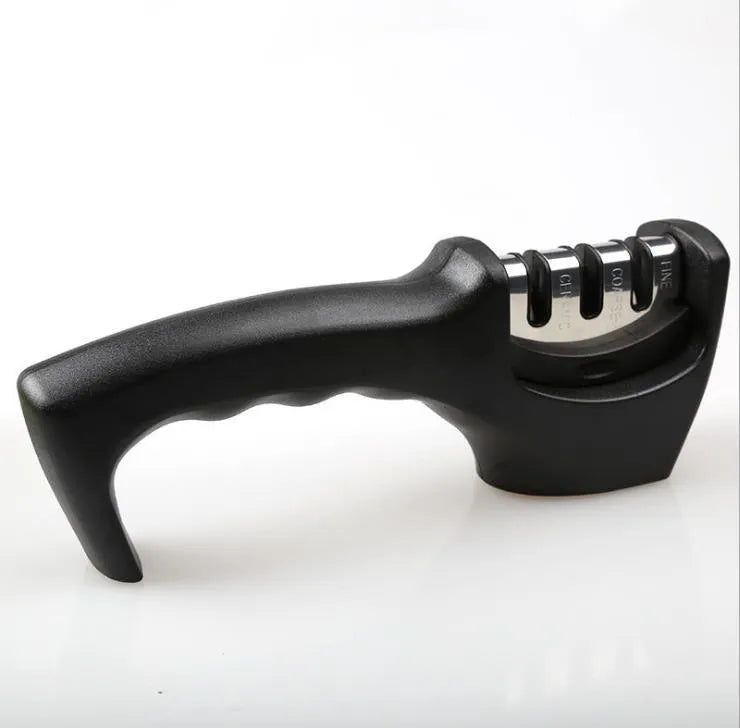 Black manual knife sharpener with three tungsten wire slots and rubber feet on base