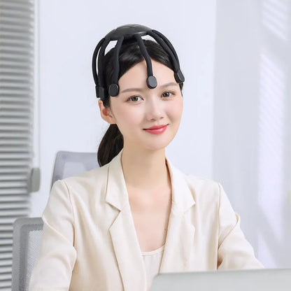 USB-powered handheld head massager with multiple flexible claws in black colour.