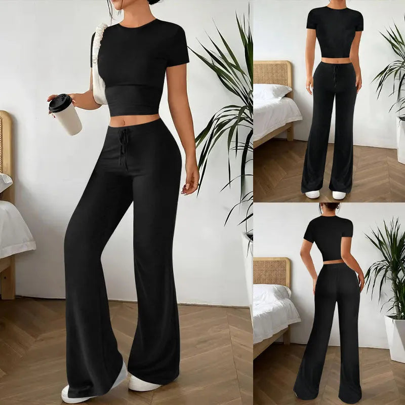 Black high waist trousers and regular sleeve t-shirt suit set on a model, showing the coordinated two-piece outfit