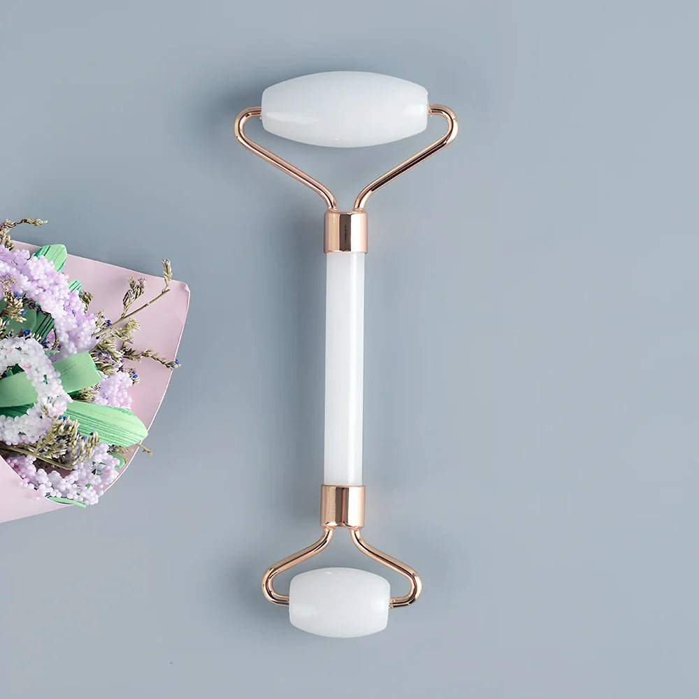 White jade facial roller with dual heads and matching scraping board for traditional Chinese massage therapy