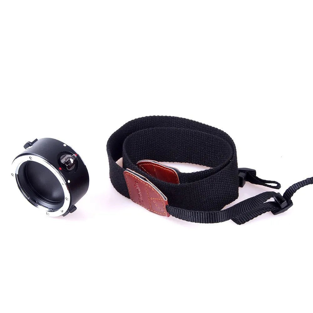 Aluminium alloy Nikon E-Mount lens flipper holding two camera lenses with cotton shoulder strap