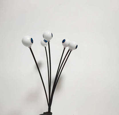 Solar-powered Halloween string lights with detailed eyeball design for outdoor garden decoration