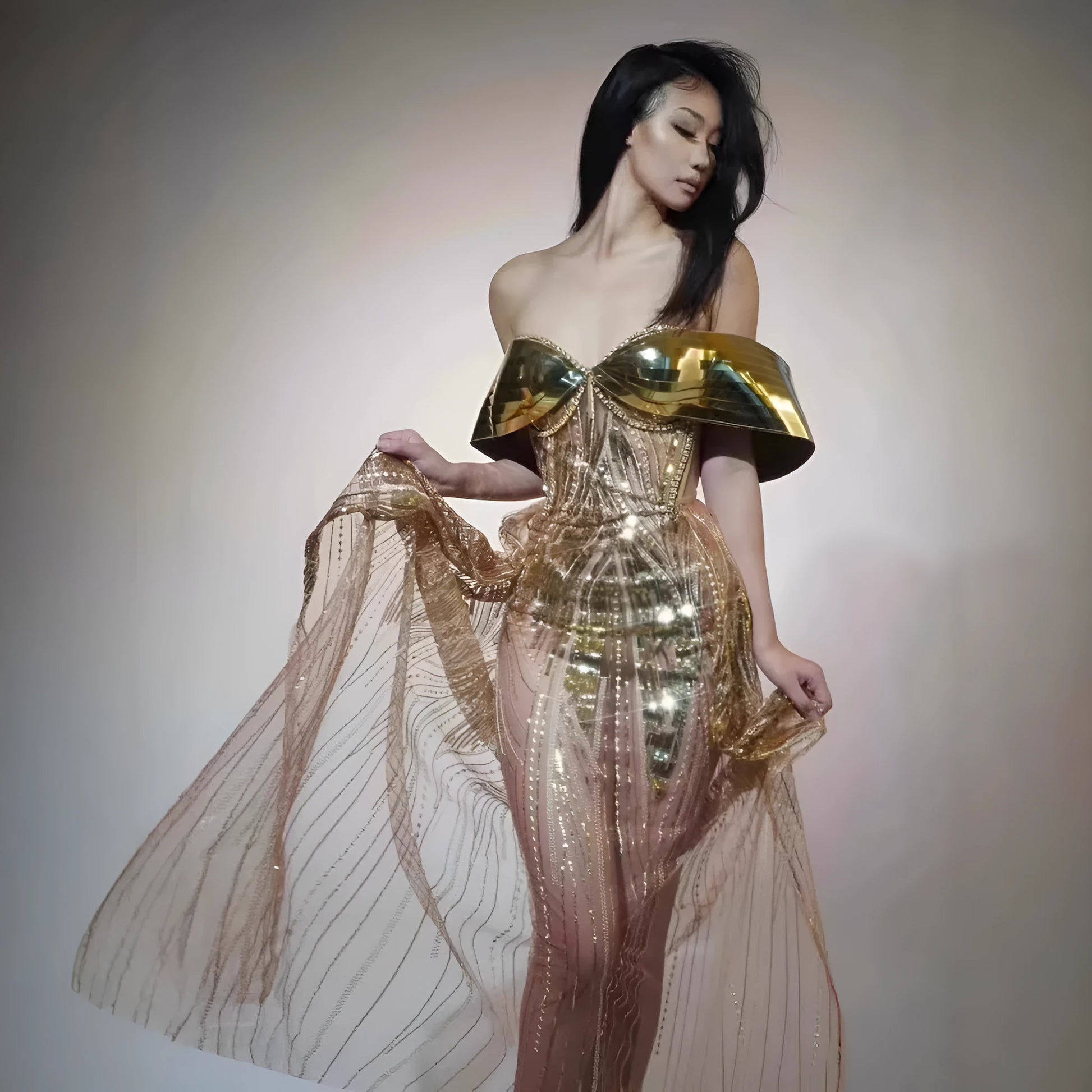 Gold strapless sequined tulle dress with thigh-high split and floor-length skirt