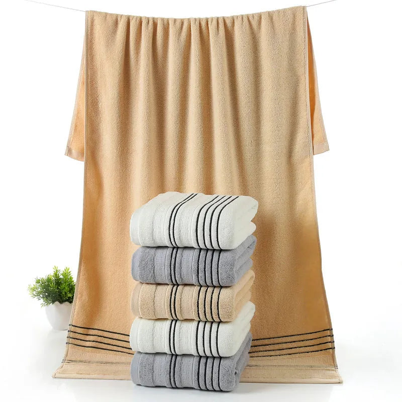 100% cotton bath towel set showing white, grey, and khaki colour options