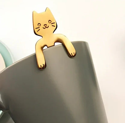 Stainless steel coffee spoon with cartoon cat handle design showing 11.7cm measurement scale