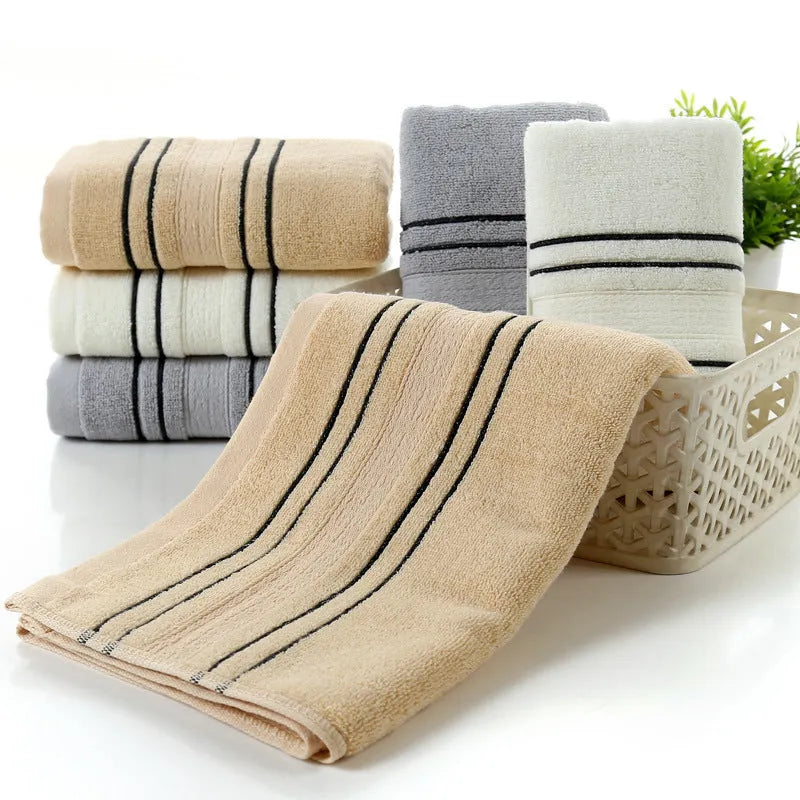 100% cotton bath towel set showing white, grey, and khaki colour options