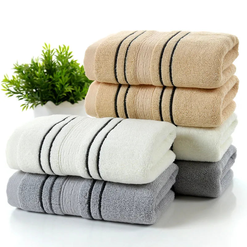 100% cotton bath towel set showing white, grey, and khaki colour options