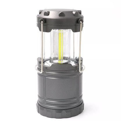 Solar-powered COB camping lamp with telescopic design and fold-away handles
