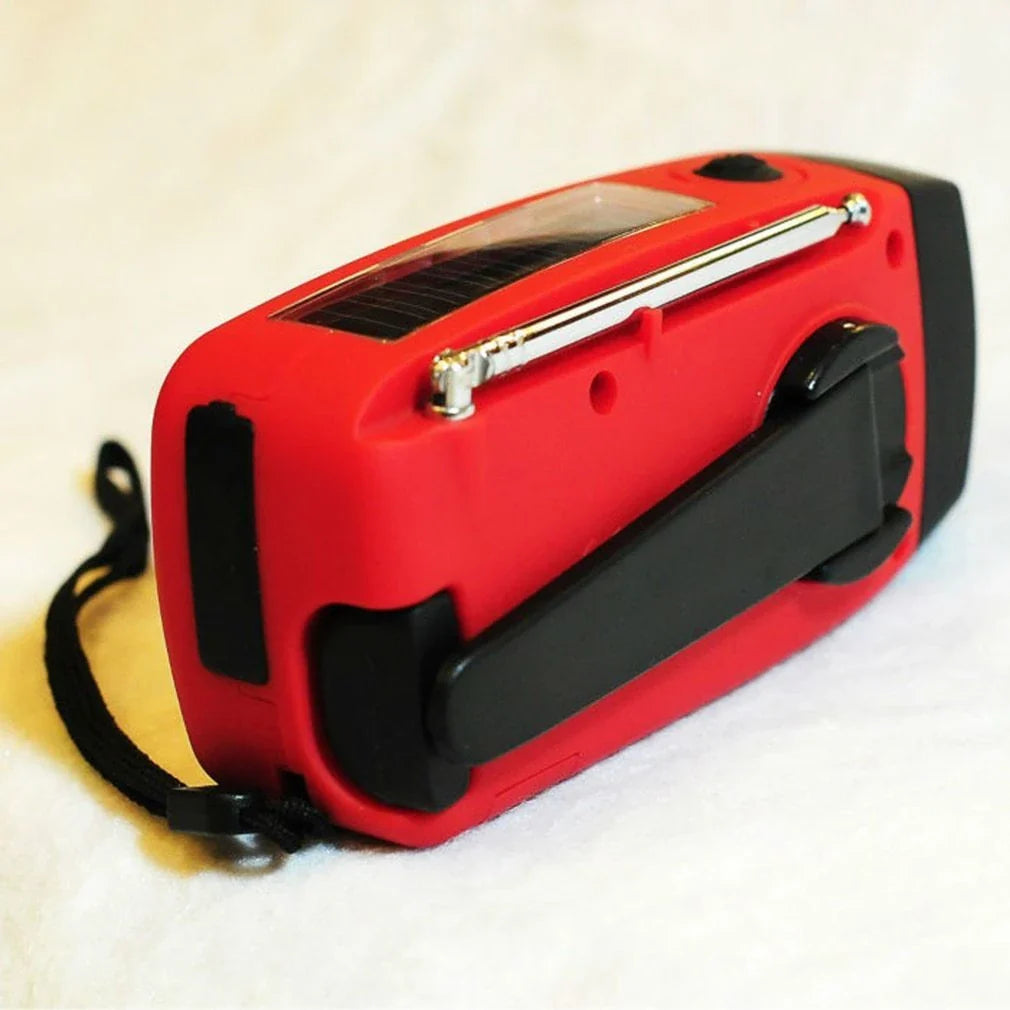 Powerful solar-powered radio and flashlight with hand crank and USB charging capabilities