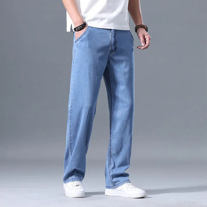 Man wearing light blue loose-fit straight-leg lyocell blend casual jeans.