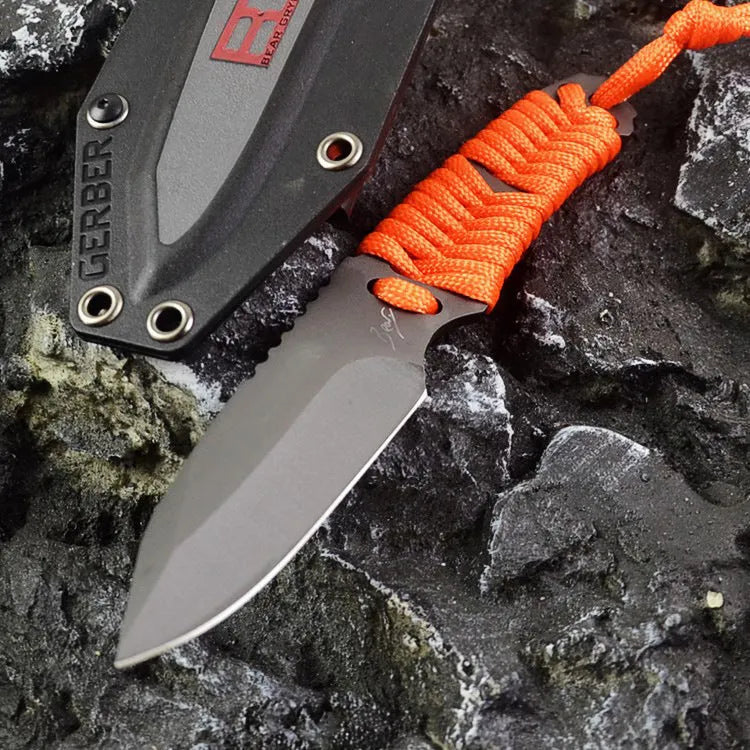 Outdoor survival knife with straight blade, rope-bound handle, and black ABS sheath on grey background