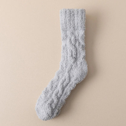 Cozy coral fleece socks in various colors, designed for superior comfort and warmth