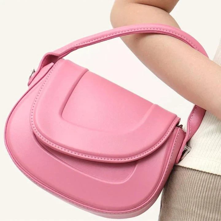 Elegant minimalist beige saddle-shaped shoulder bag with adjustable straps