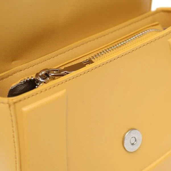 Elegant minimalist beige saddle-shaped shoulder bag with adjustable straps