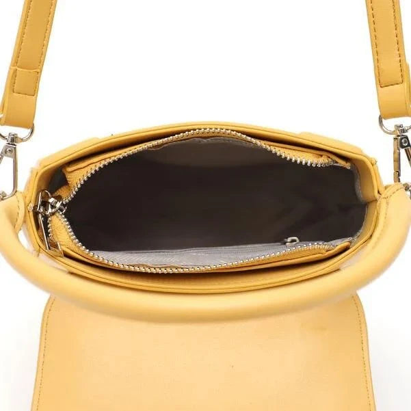 Elegant minimalist beige saddle-shaped shoulder bag with adjustable straps