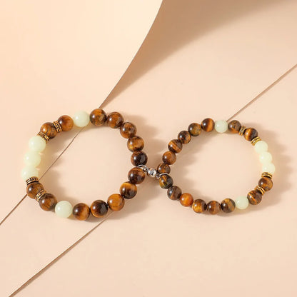 Amber geometric couple bracelets with luminous elements and retro patterning