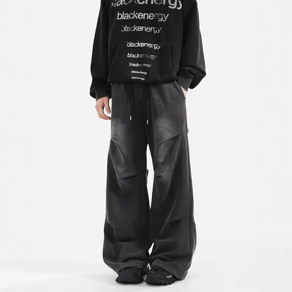 Men's cotton straight-leg sweatpants in black and gray with pleated washed finish and elastic waist