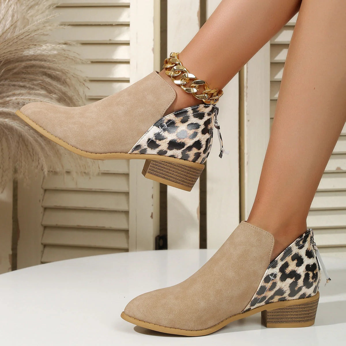 Women's leopard print boots with pointed toe and chunky heel in various colors