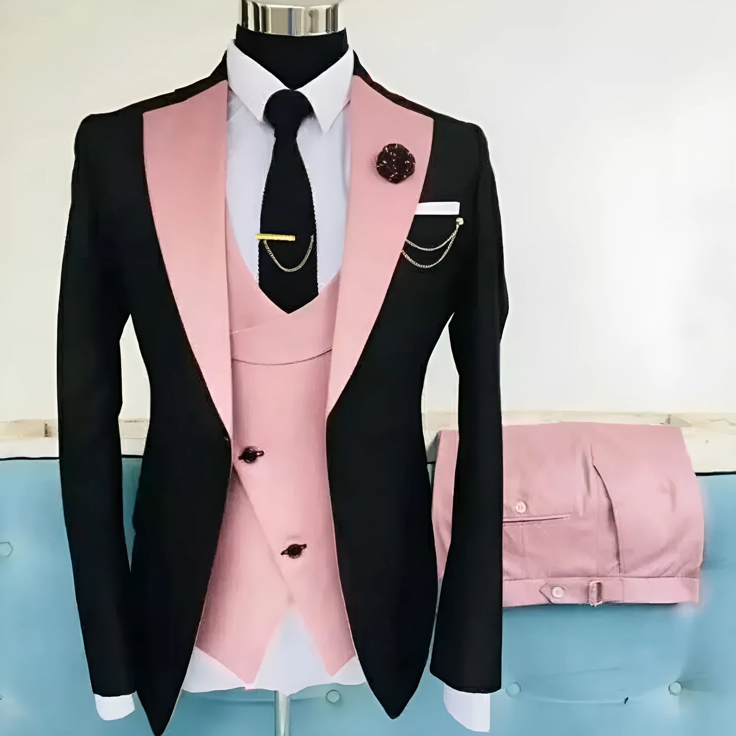Men's slim fit three-piece business suit in black with contrasting vest, showing complete coat, vest, and trousers set