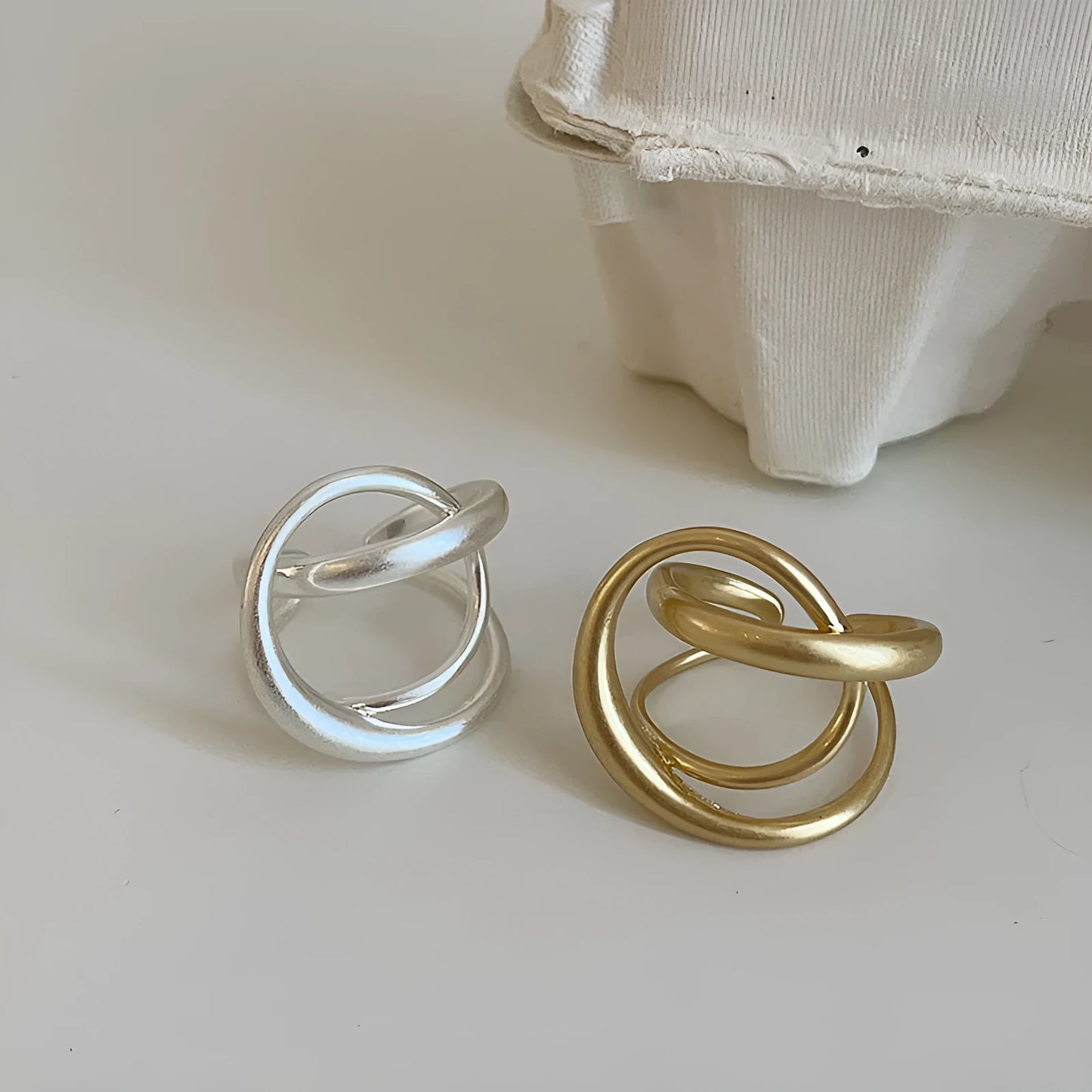 Geometric open ring with interlaced pattern and matte finish, adjustable for finger sizes 16mm to 20mm