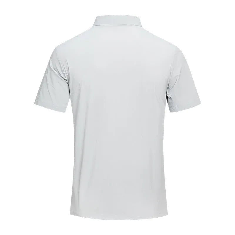 Man wearing a solid colour quick-dry polo shirt with short sleeves and a side slit detail.
