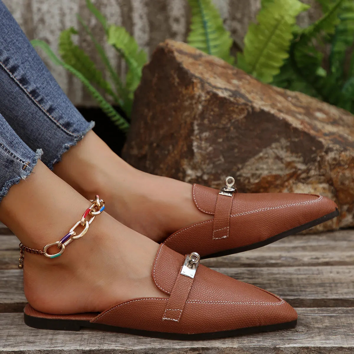Light brown women's pointed-toe low heel slip-on slippers with a PU leather upper and rubber sole.