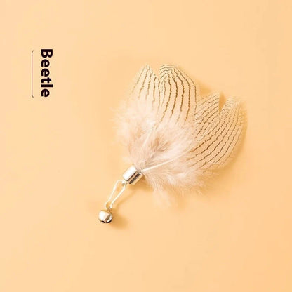 Three steel wire cat toy replacement heads with small flying insect designs in varied colours