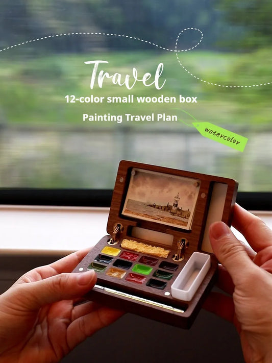 Mini walnut watercolour paint box with 12 half-pan slots, brass clasp, and compact 18cm size for portable art supplies