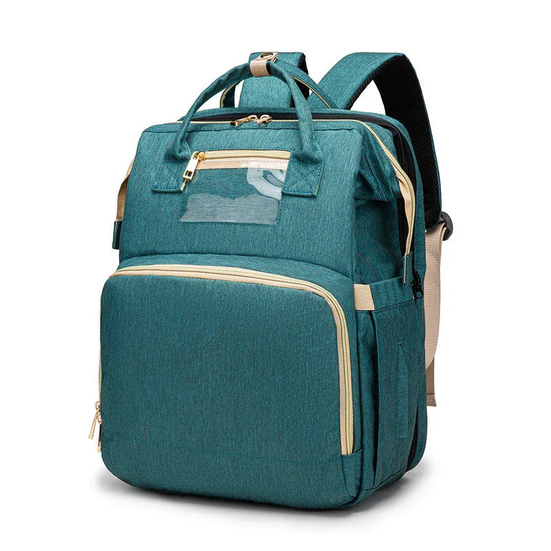 Versatile baby changing backpack with USB charging port and folding portable bed