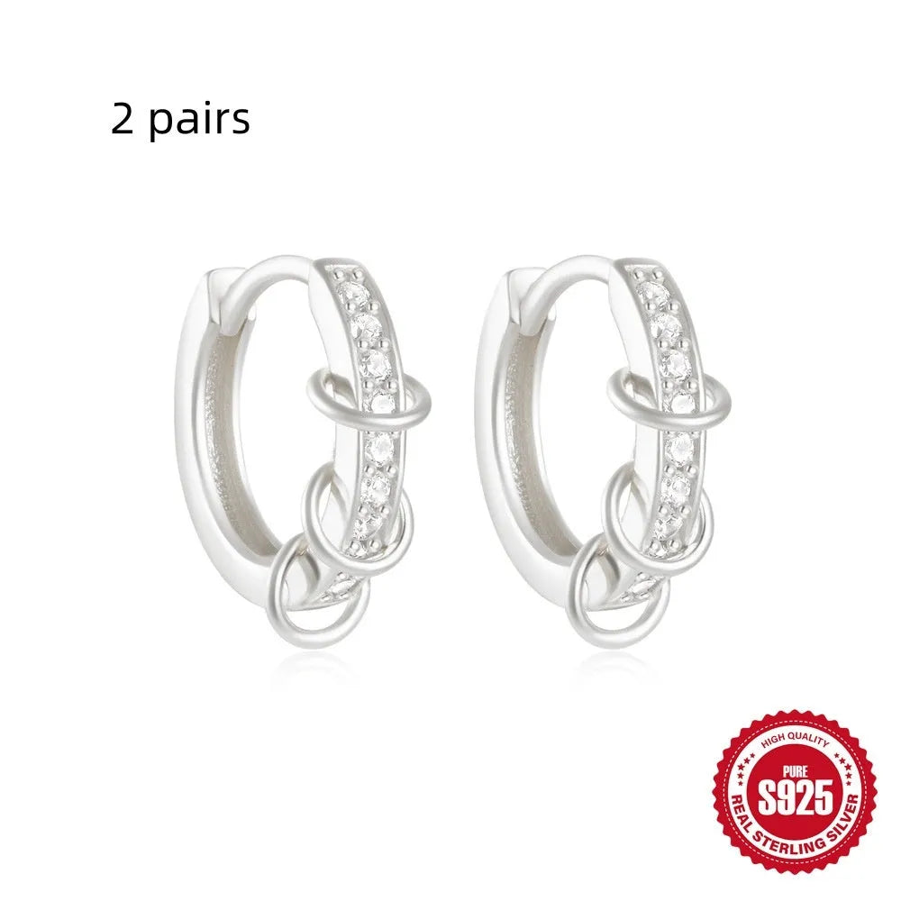 Sterling silver geometric stud earrings with small round diamond accents in gold or silver finish