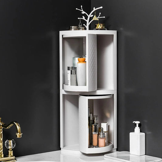 Rotatable bathroom storage organizer with a sleek, white plastic design and a covered front panel to protect against dust.
