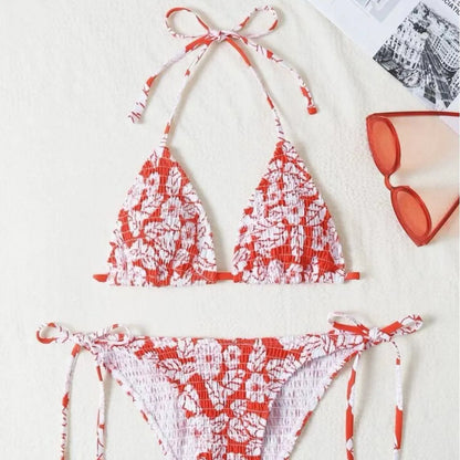 Women's floral halter neck swimsuit set in polyester fabric showing bra top and briefs