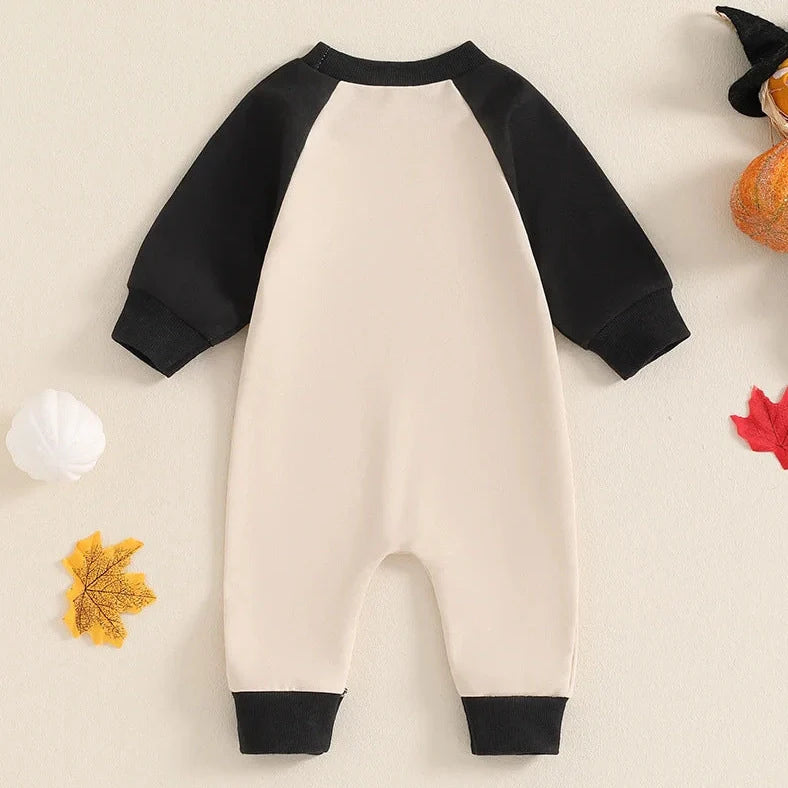 Apricot colour blocked baby jumpsuit with letter ghost embroidery, long sleeves, and pullover closure