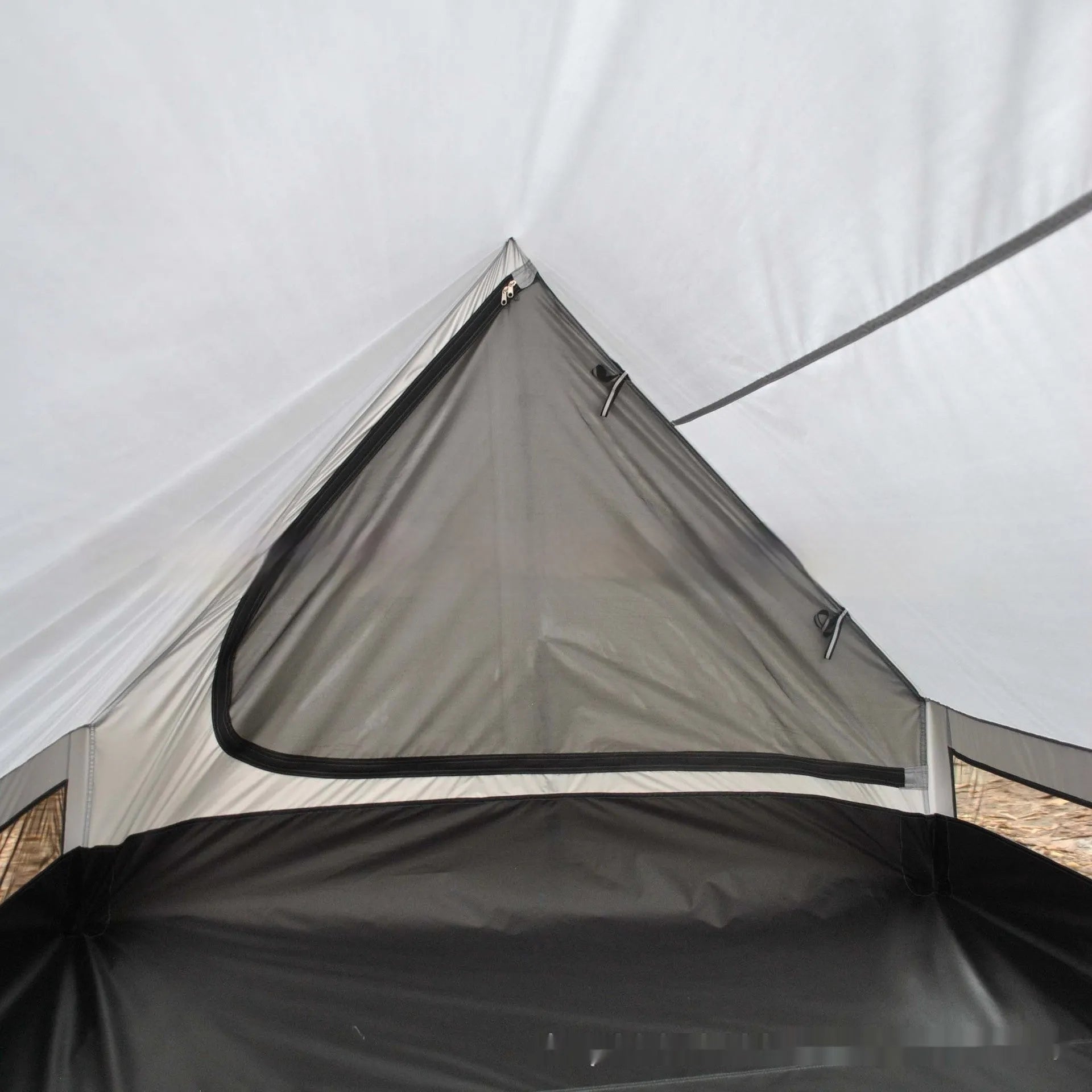 Brown and white portable A-line camping tent set up with hiking poles, showing its spacious interior for 2-3 people.