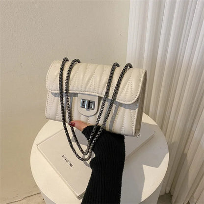 Retro textured diamond pattern women's small bag in beige colour with soft carry handle and single shoulder strap