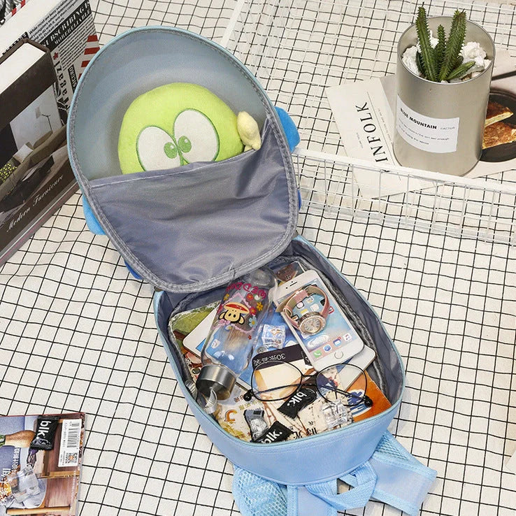 Blue aircraft-shaped children's hard shell backpack with cartoon graphics and adjustable shoulder straps