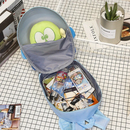 Blue aircraft-shaped children's hard shell backpack with cartoon graphics and adjustable shoulder straps